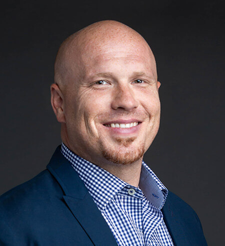 bio image of Advisor Designs' client, Travis Trettin